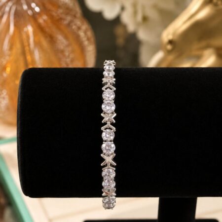 Pulsera rodio con eslabones de circonita redonda y diseño de X