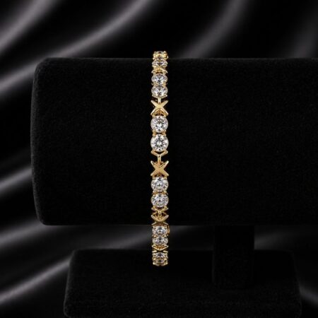 Pulsera oro con circonitas redondas y diseño de x