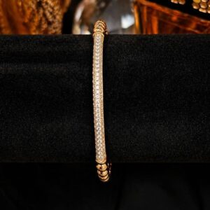 Brazalete oro esclava con circonita y detalles de esferas pulidas