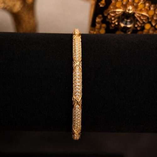 Brazalete oro con circonitas y diseño de X
