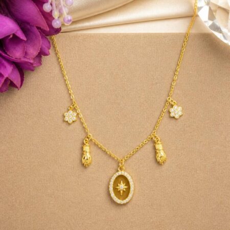 Cadena oro con dijes de mano de figa y estrellas con circonita