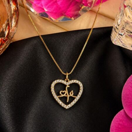 Cadena fina oro con dije mediano en forma de corazón con circonitas y la palabra Fe