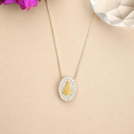 Cadena fina rodio condije oval completo de circonita y en el centro la virgen en oro cod co126 280.000 gs